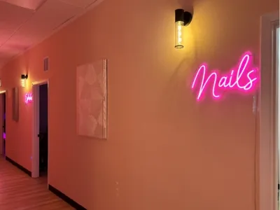 The softly lit hallway to Glow Day Spa’s private treatment rooms